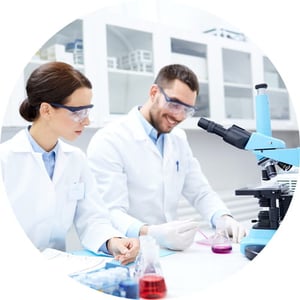 Man and woman conducting research in a lab.