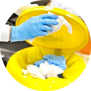 Lab worker practicing proper disposal