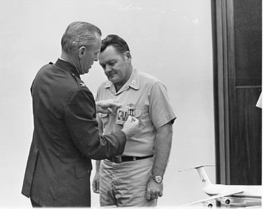 Veteran, Captain Simmang, receives the Flying Cross