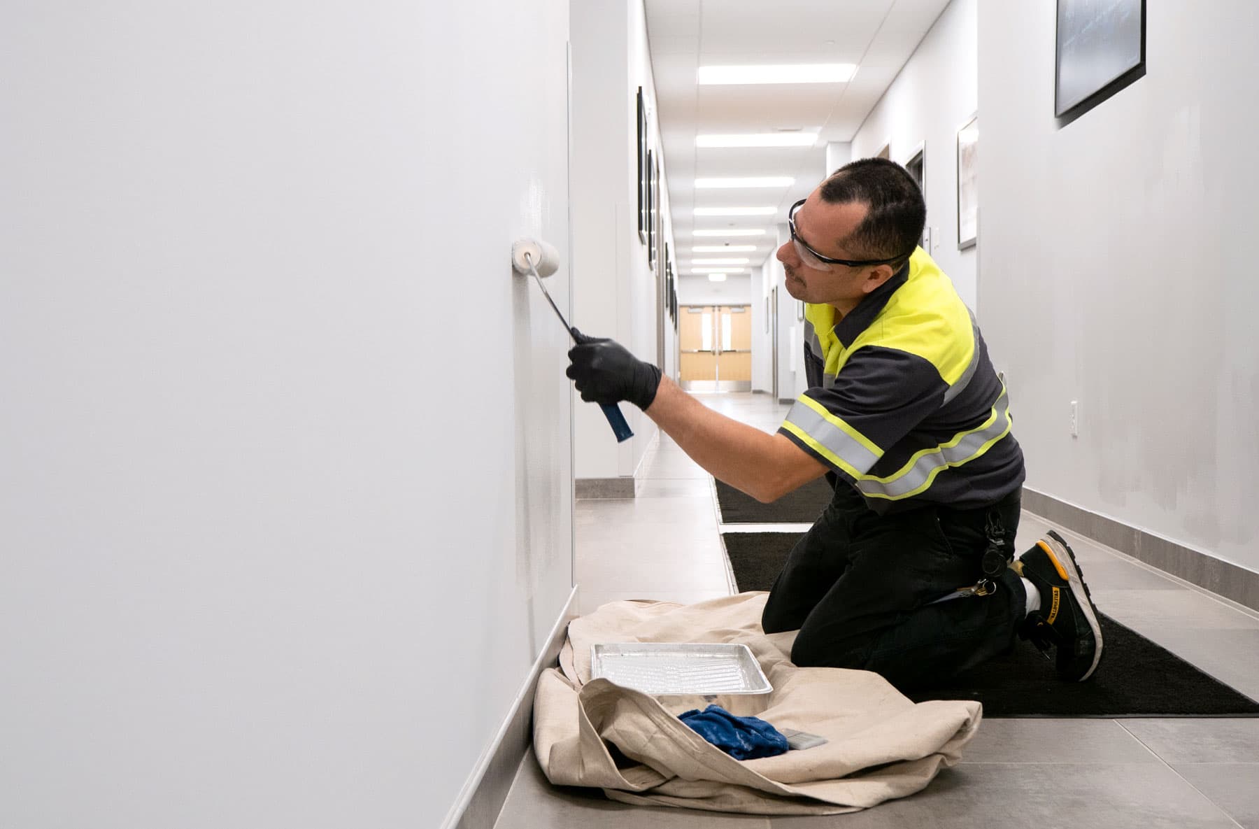 Person painting wall